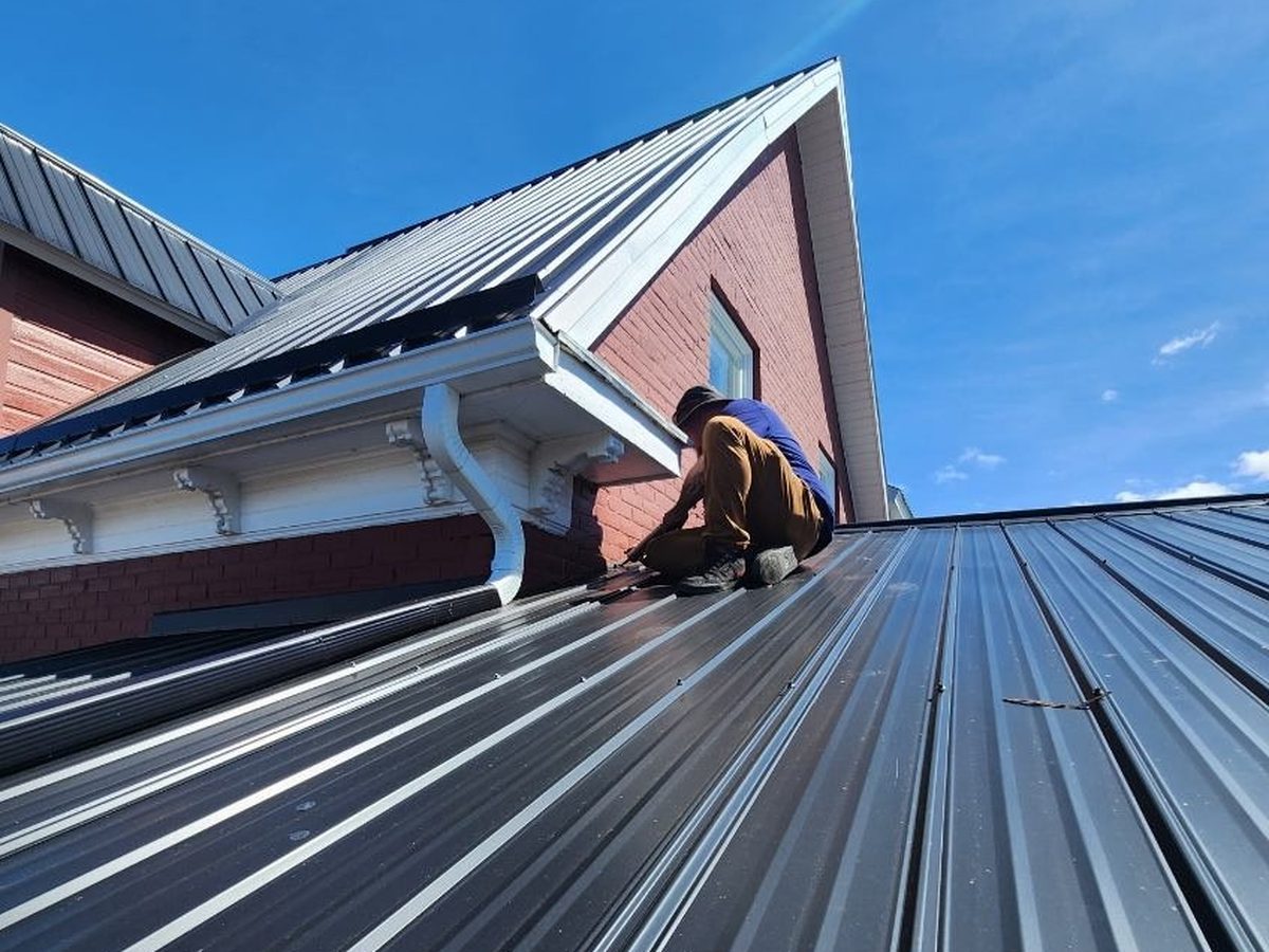 Working the gable and soffit line on a steel roof